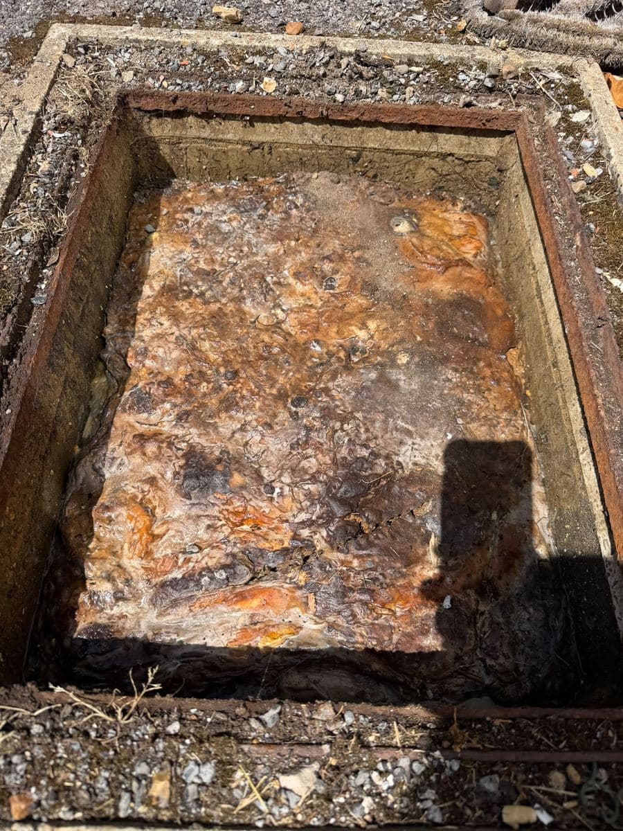 Inspection chamber silted up with debris