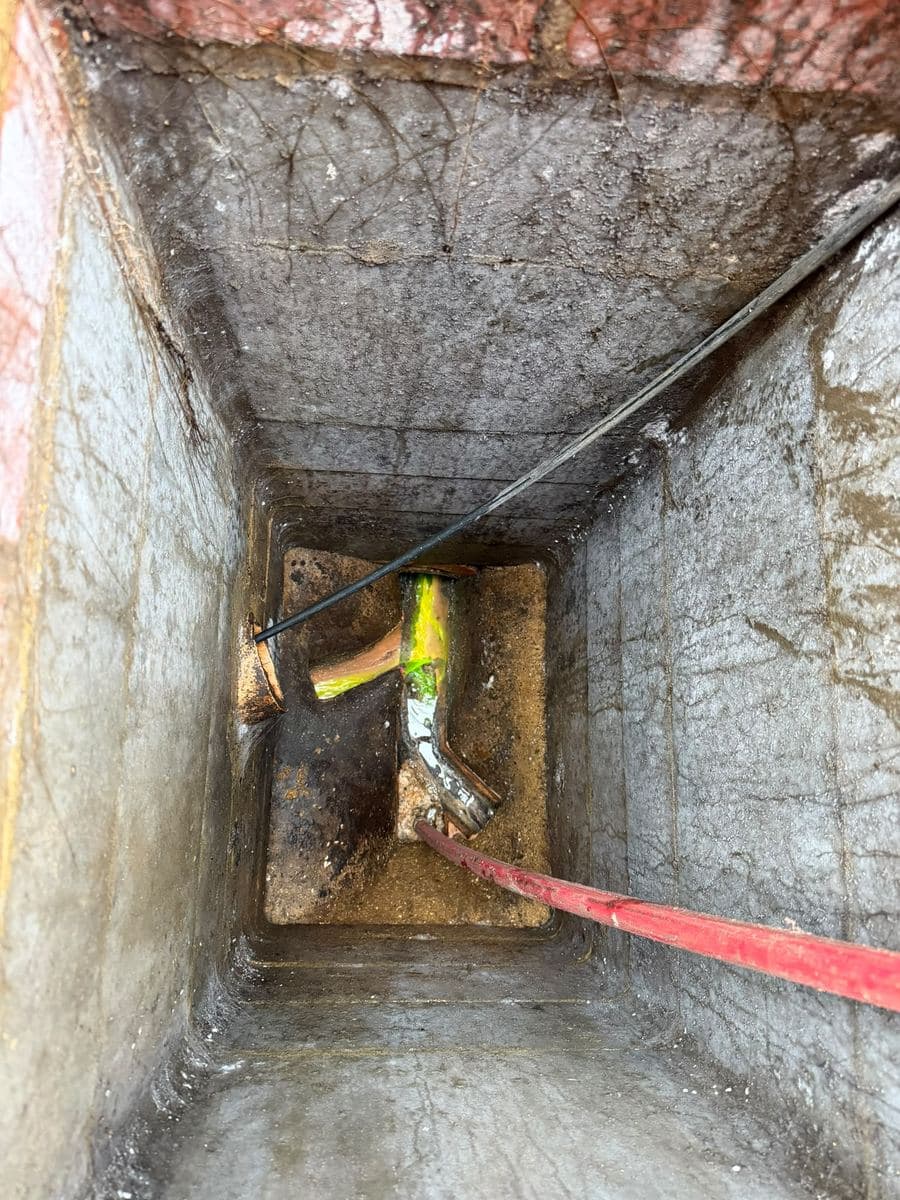Deep inspection chamber being cleaned during a maintenance visit