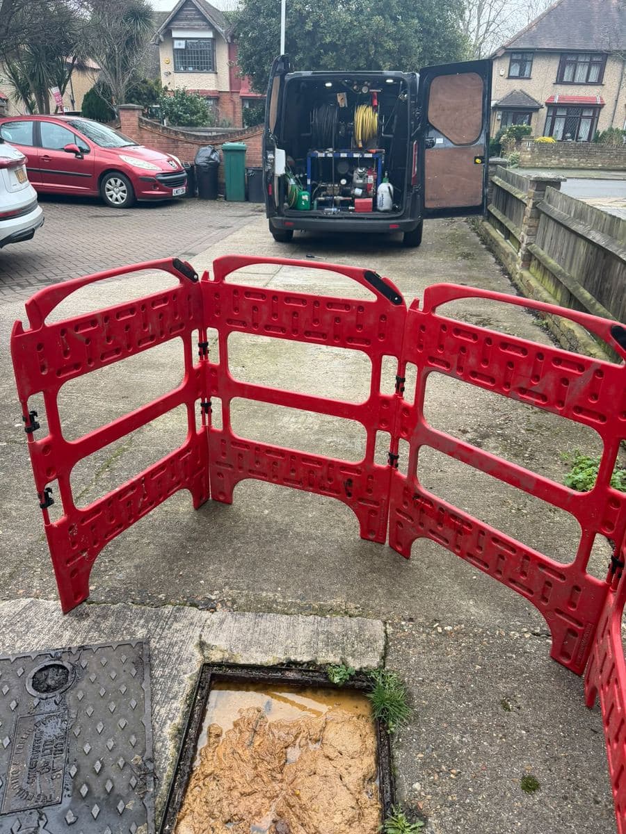 AllTime Drainage van with safety barriers set up at a job